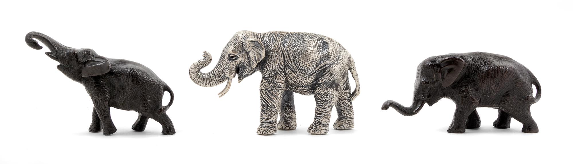 A Group of Three Metal Figures of Elephants
