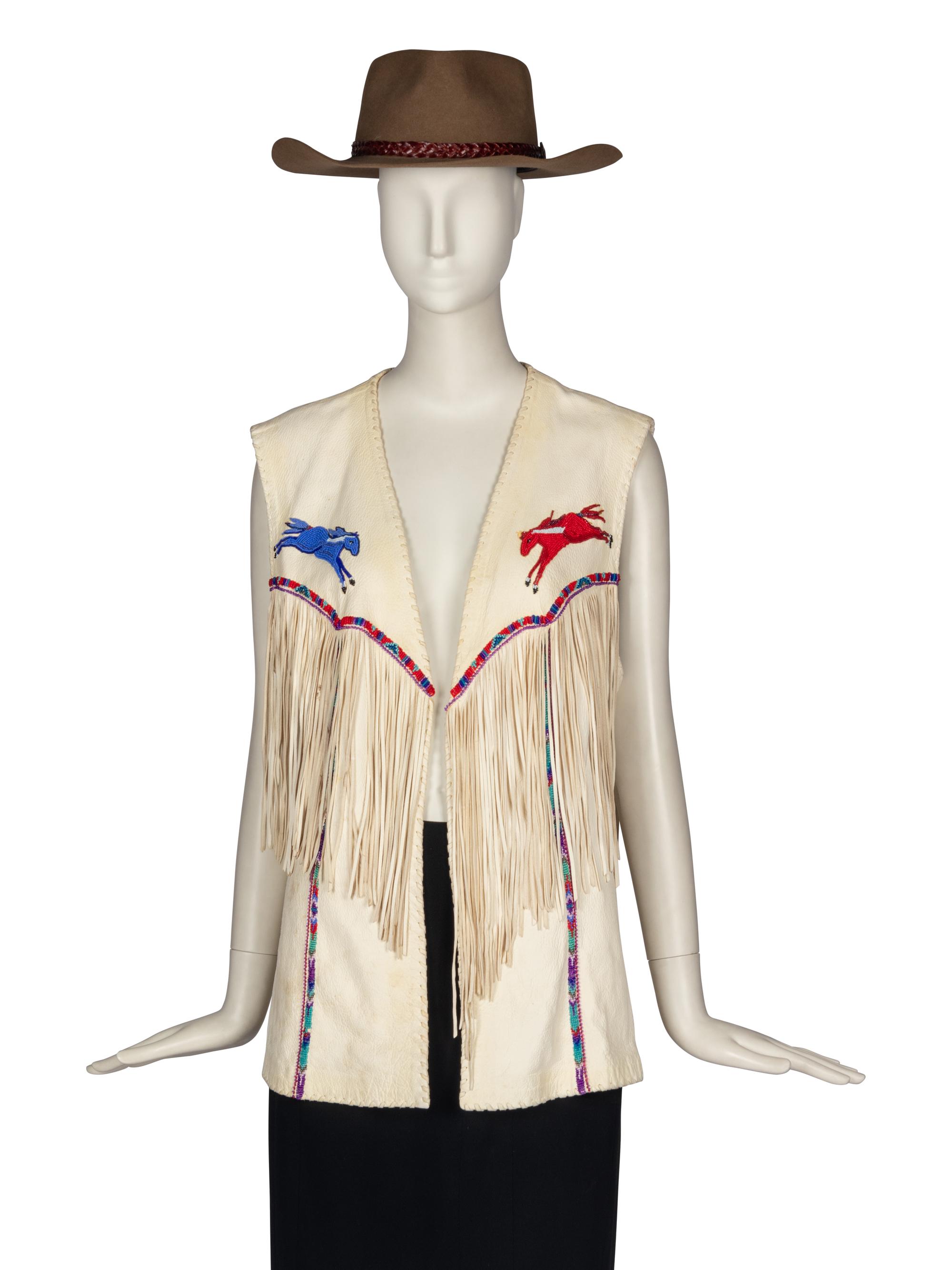 A Beaded Leather Vest with Fringe and Felted Hat