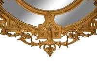 A Napoleon III Giltwood Oval Mirror