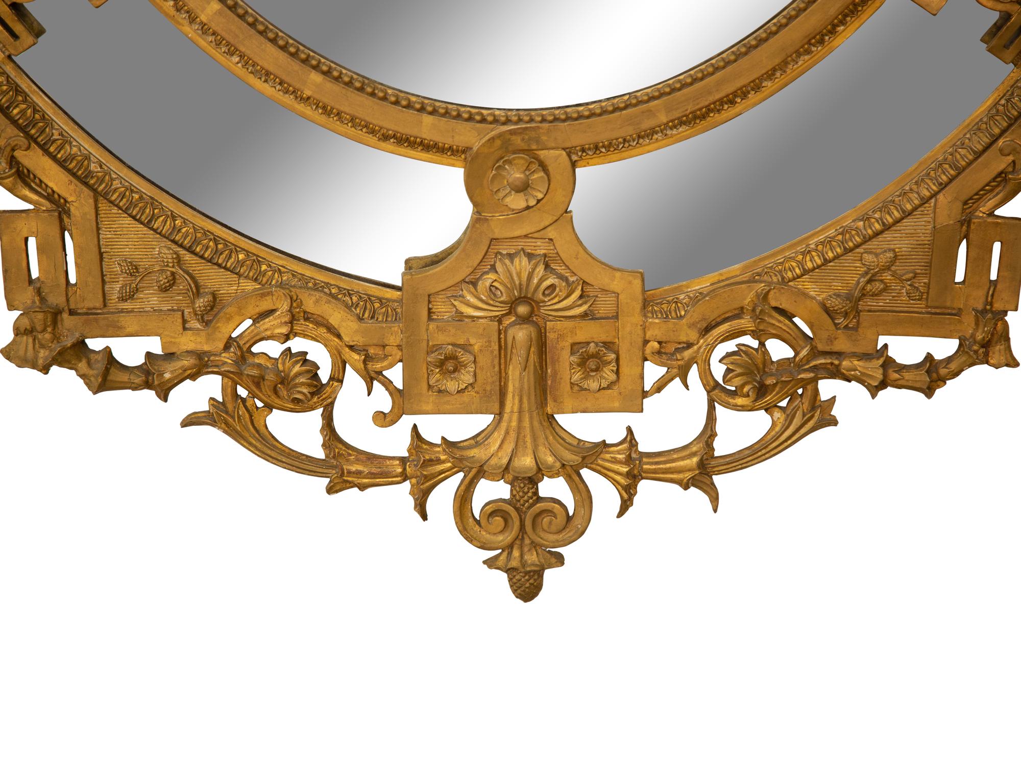 A Napoleon III Giltwood Oval Mirror