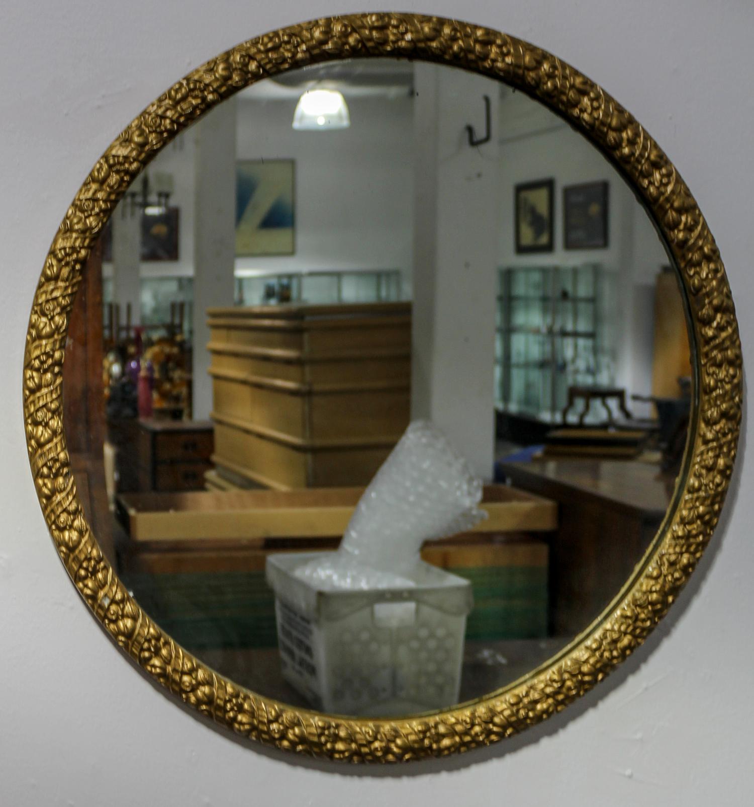 A Circular Giltwood Mirror Diameter 26 1/2 inches.