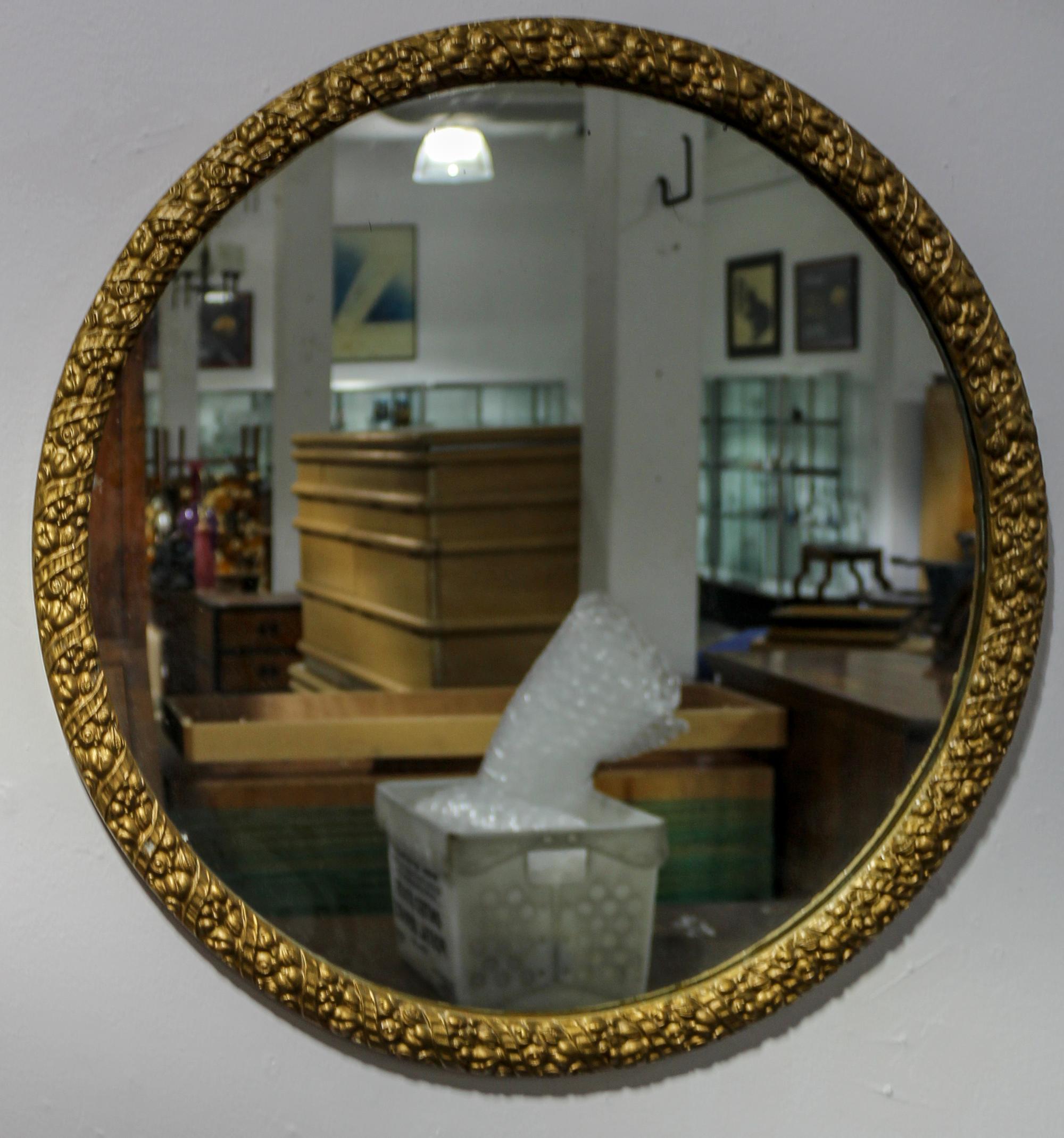 A Circular Giltwood Mirror Diameter 26 1/2 inches.
