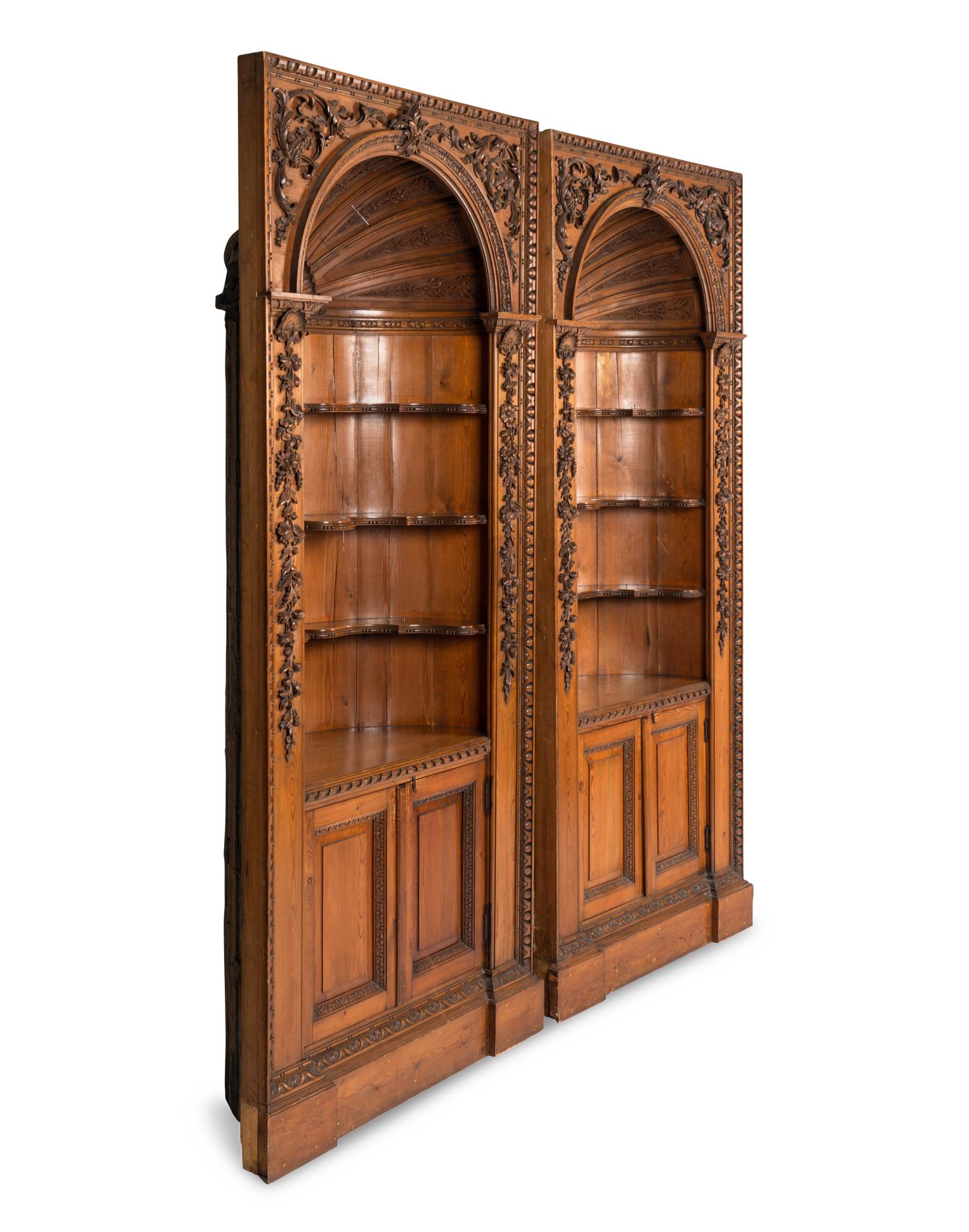 A Pair of English Carved Pine Cupboards