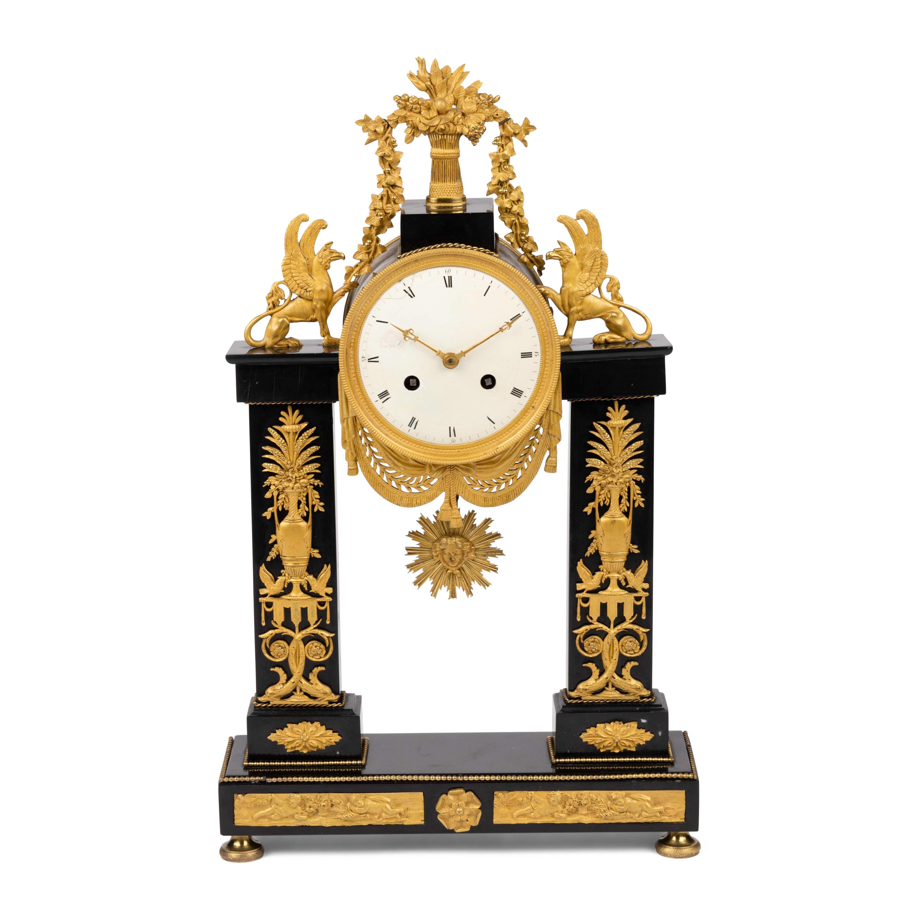 An Empire Patinated and Gilt Bronze Mantel Clock