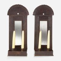 A pair of mirrored tinware candle sconces 20th century