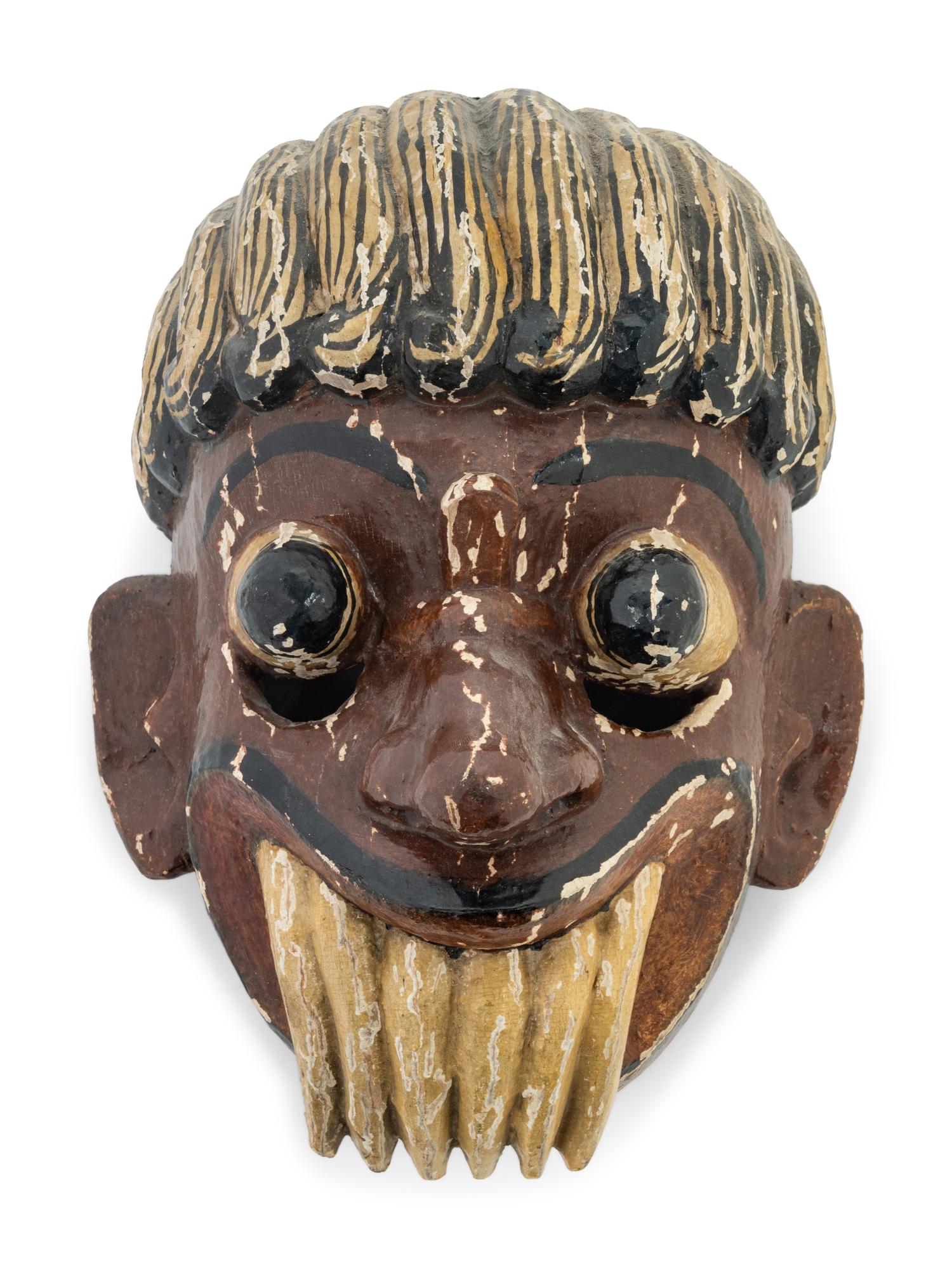 A Mexican Carved and Polychromed Wood Mask
