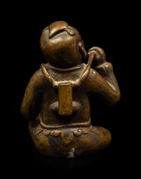 A Small Chinese Bronze Figure of a Seated Boy