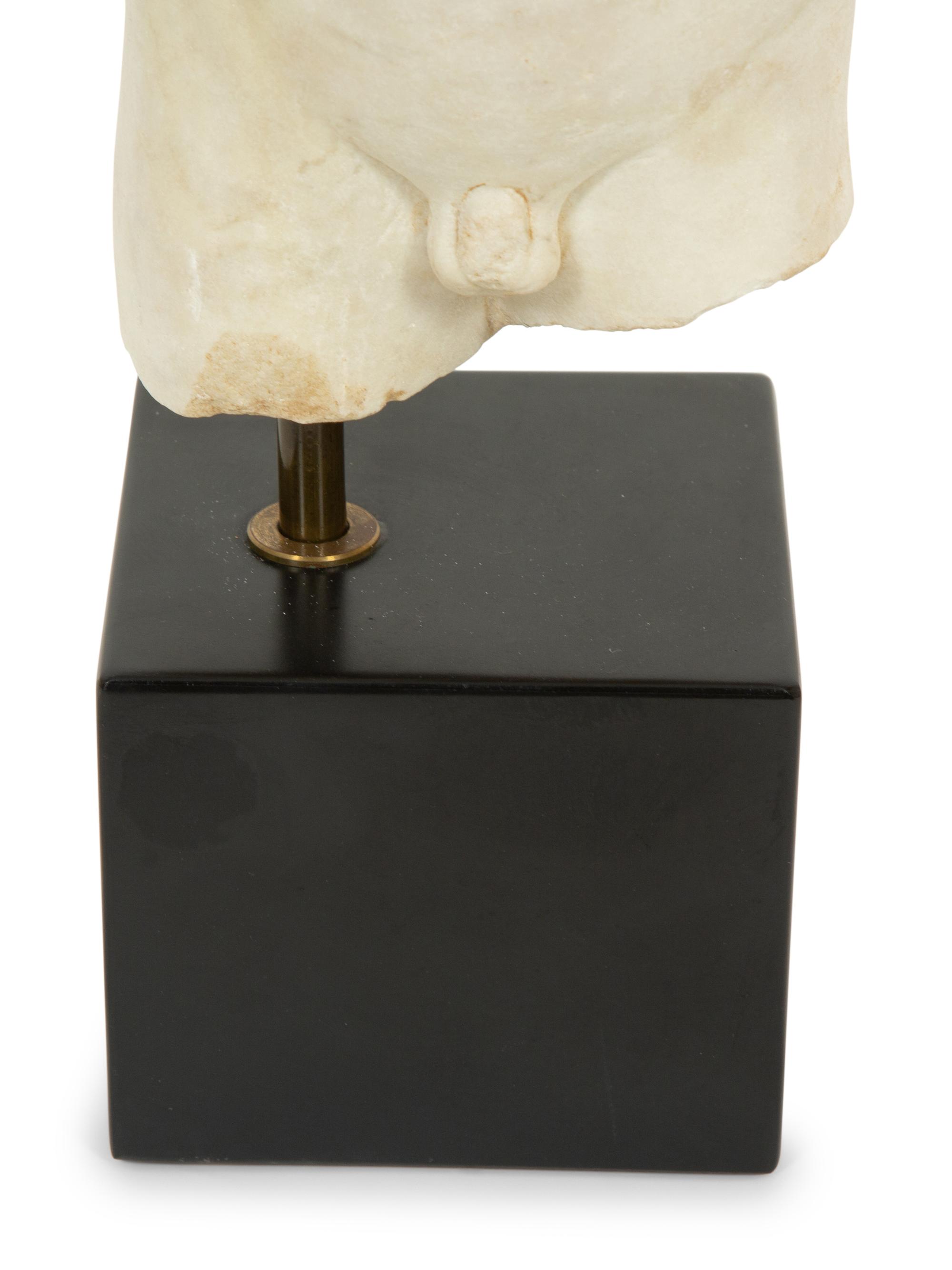 A Continental Carved Marble Male Torso