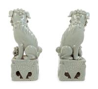 A Pair of Chinese Blue Glazed Porcelain Figures of Fu Lions
