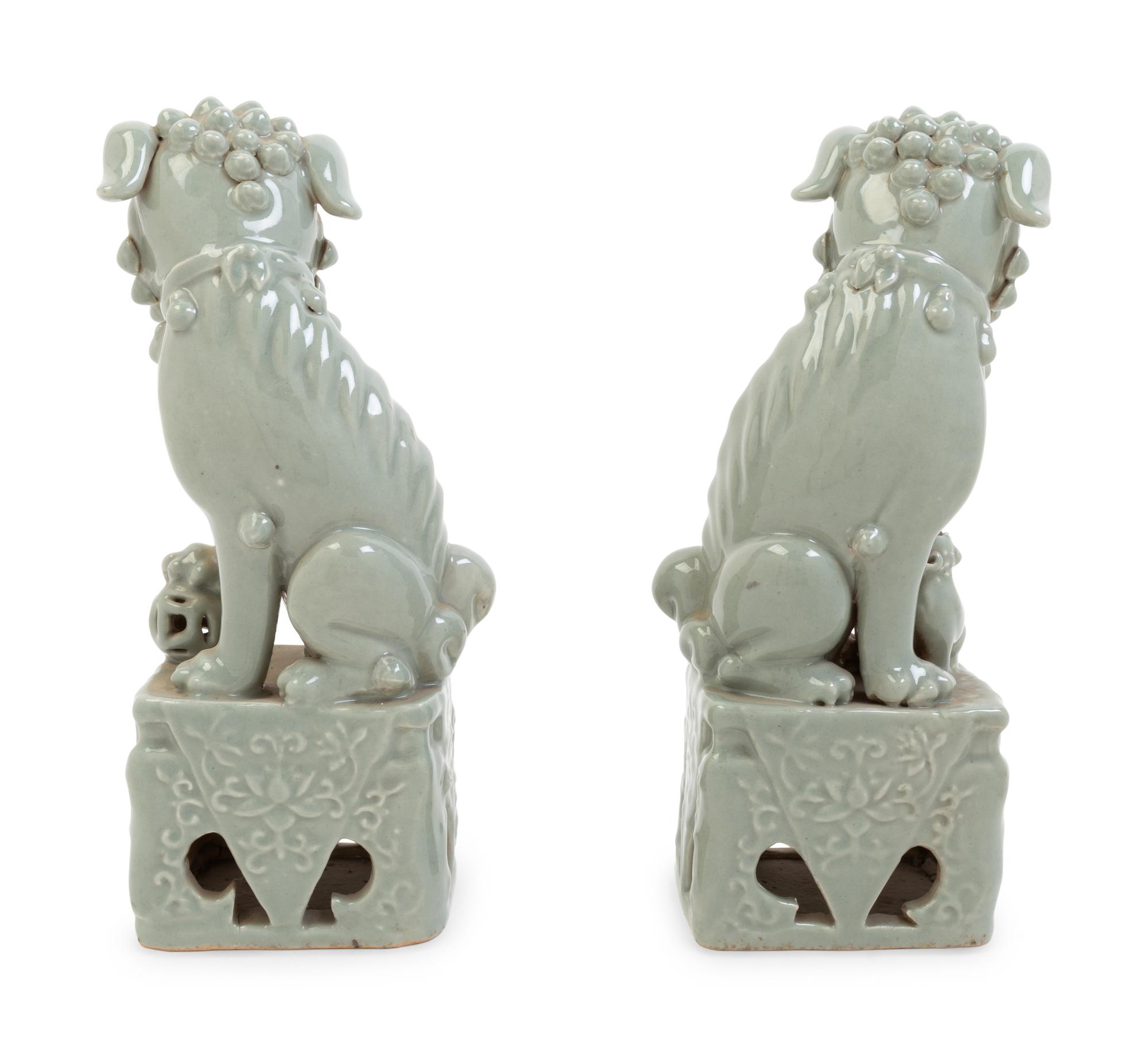 A Pair of Chinese Blue Glazed Porcelain Figures of Fu Lions