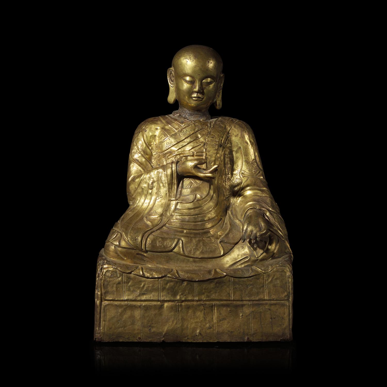A Mongolian Gilt Copper Repoussé Figure of a Seated Luohan or Monk, 19th Century 清晚期 蒙古銅錘揲羅漢像