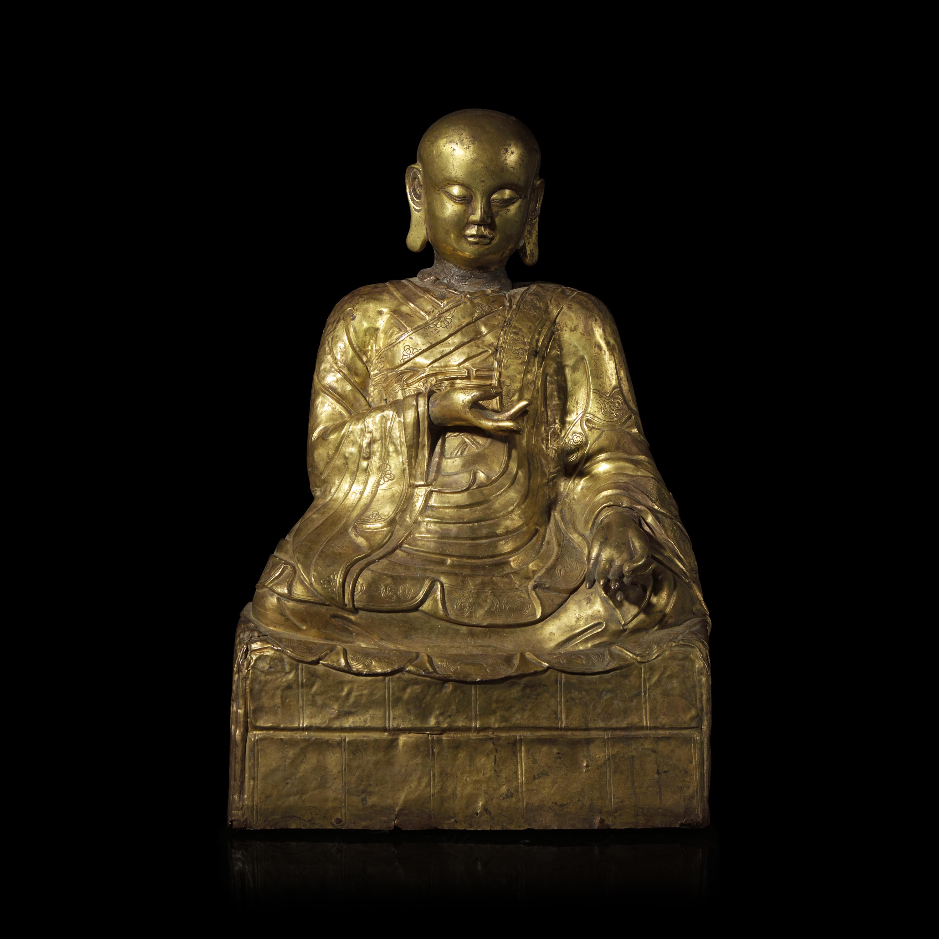 A Mongolian Gilt Copper Repoussé Figure of a Seated Luohan or Monk, 19th Century 清晚期 蒙古銅錘揲羅漢像