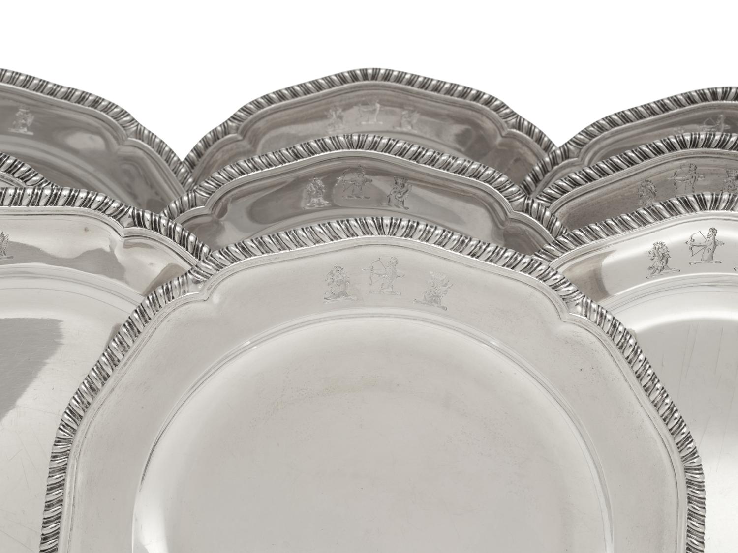 A Set of Twelve George III Silver Dinner Plates