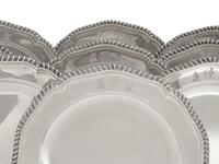 A Set of Twelve George III Silver Dinner Plates