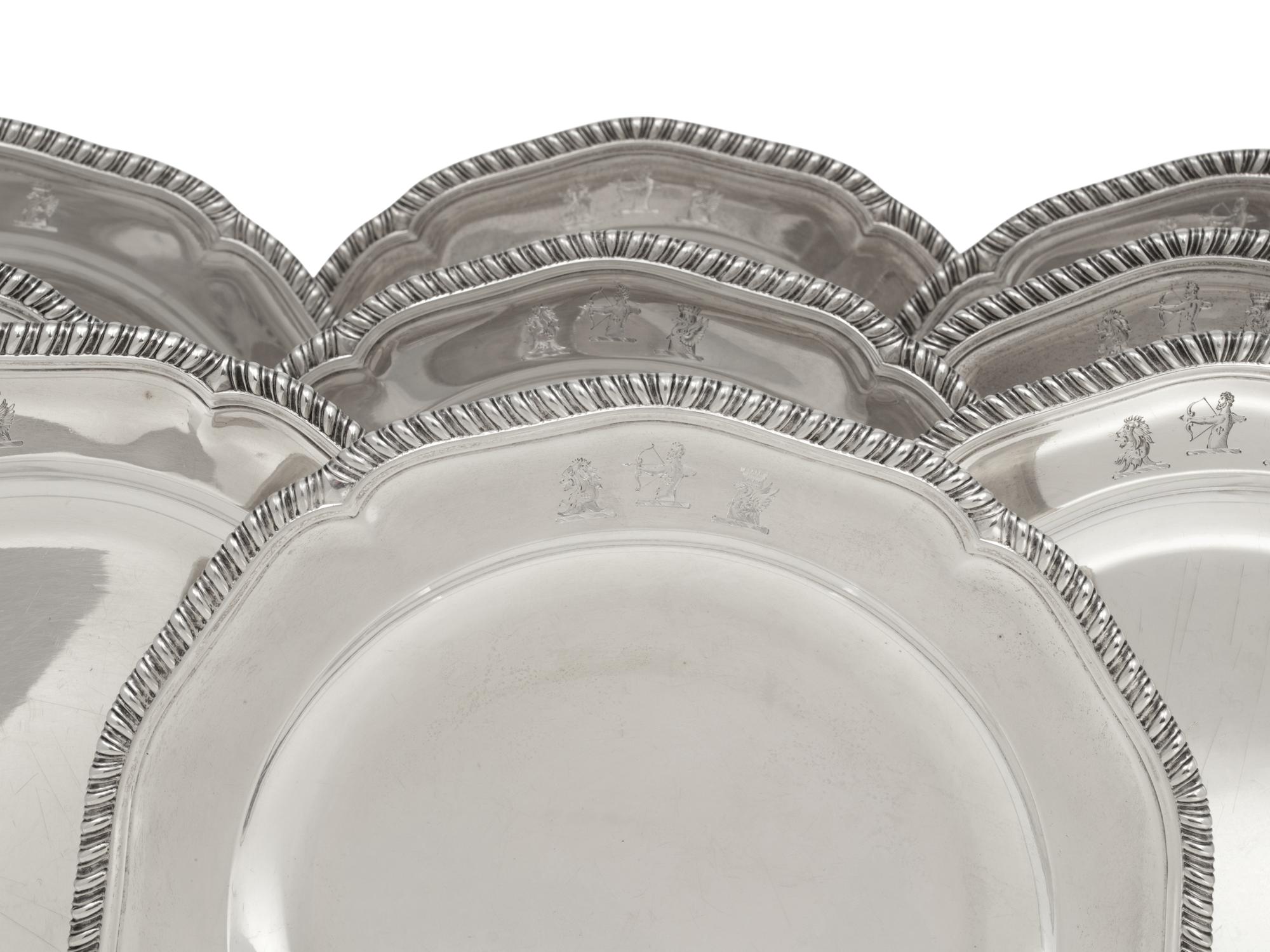 A Set of Twelve George III Silver Dinner Plates