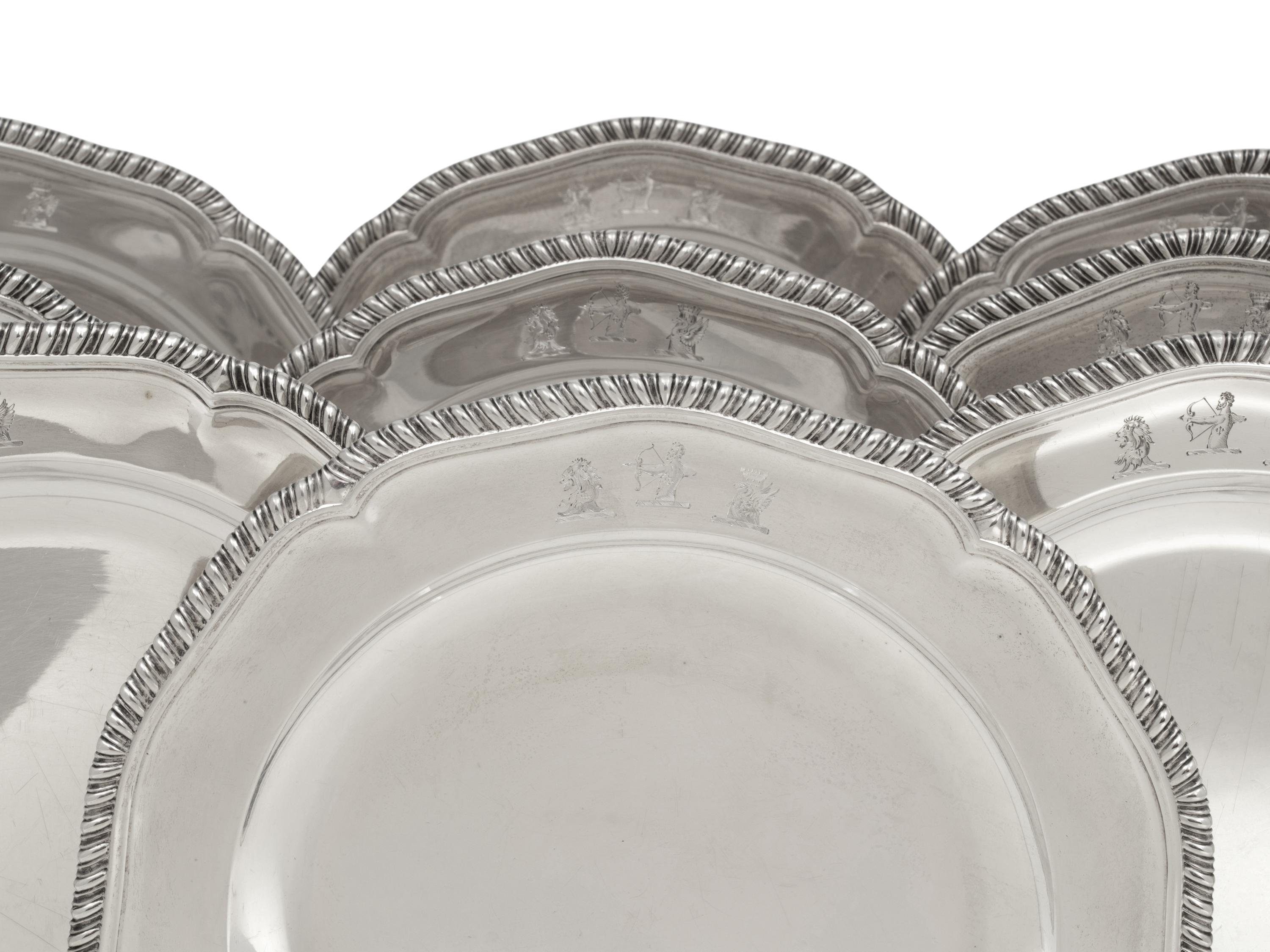 A Set of Twelve George III Silver Dinner Plates