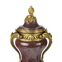 A Pair of Gilt Bronze Mounted Porphyry Urns