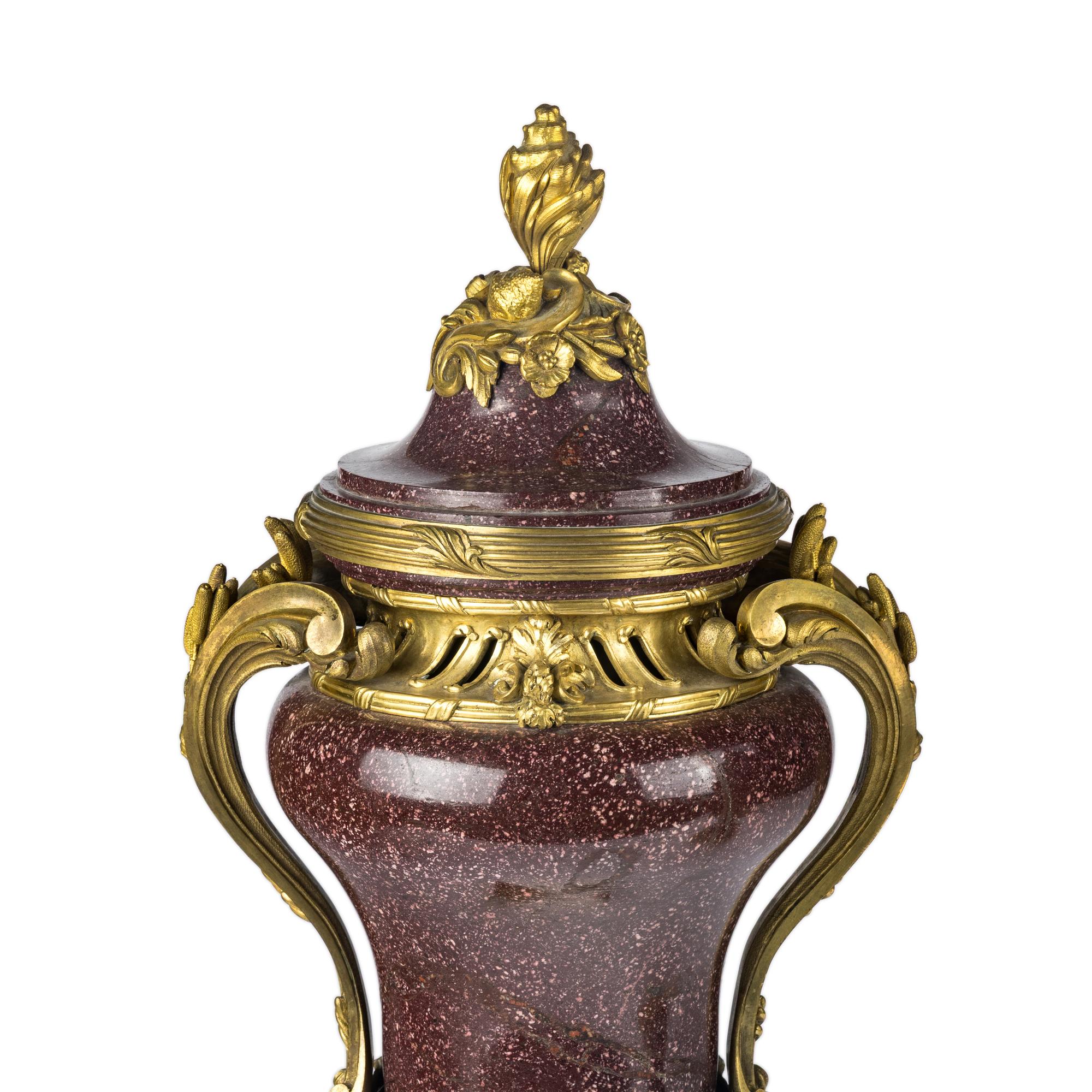 A Pair of Gilt Bronze Mounted Porphyry Urns