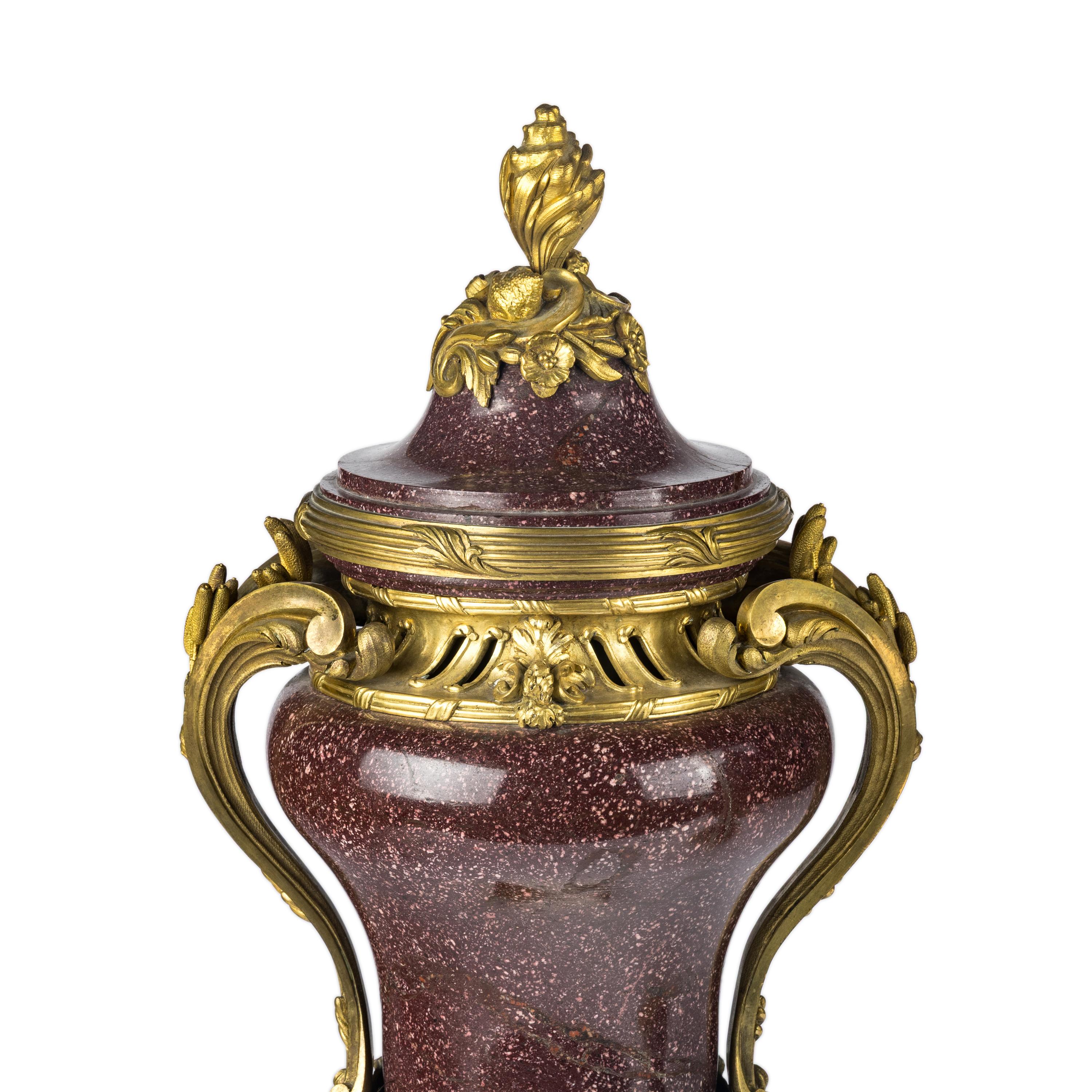 A Pair of Gilt Bronze Mounted Porphyry Urns