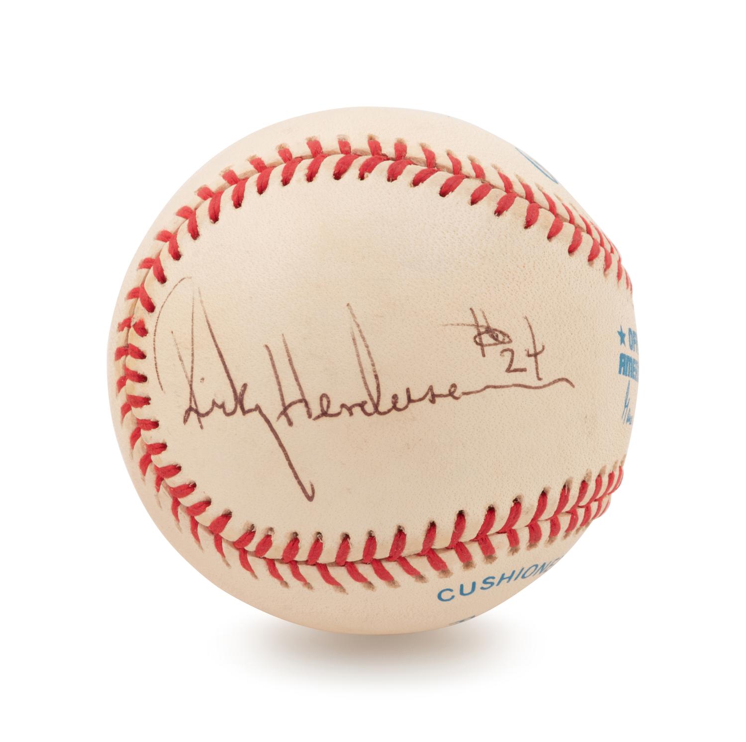 A Group of Two Signed Baseballs Including Rickey Henderson and Pete Rose