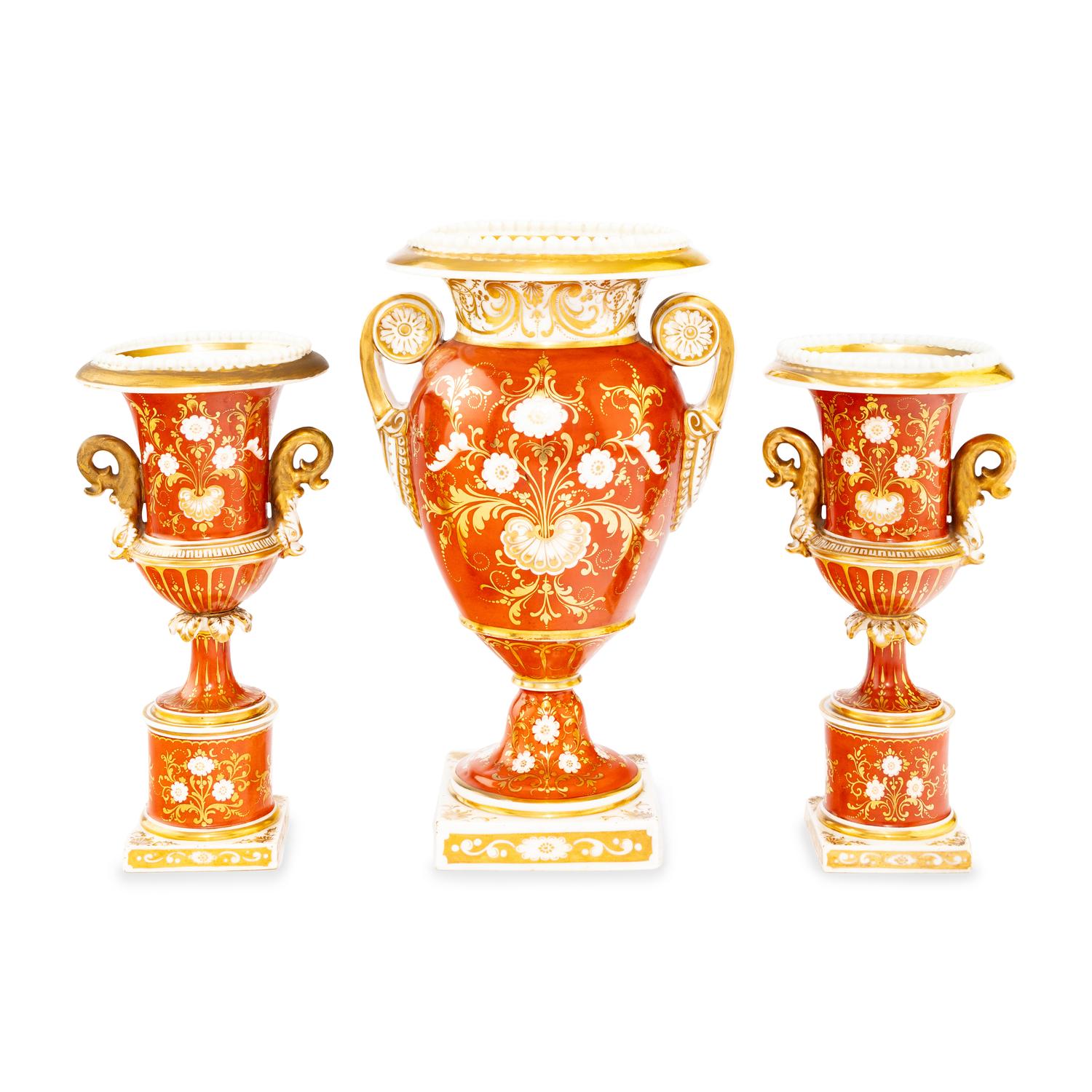 A Worcester Porcelain Hand Painted and Parcel Gilt Three-Piece Urn Garniture
