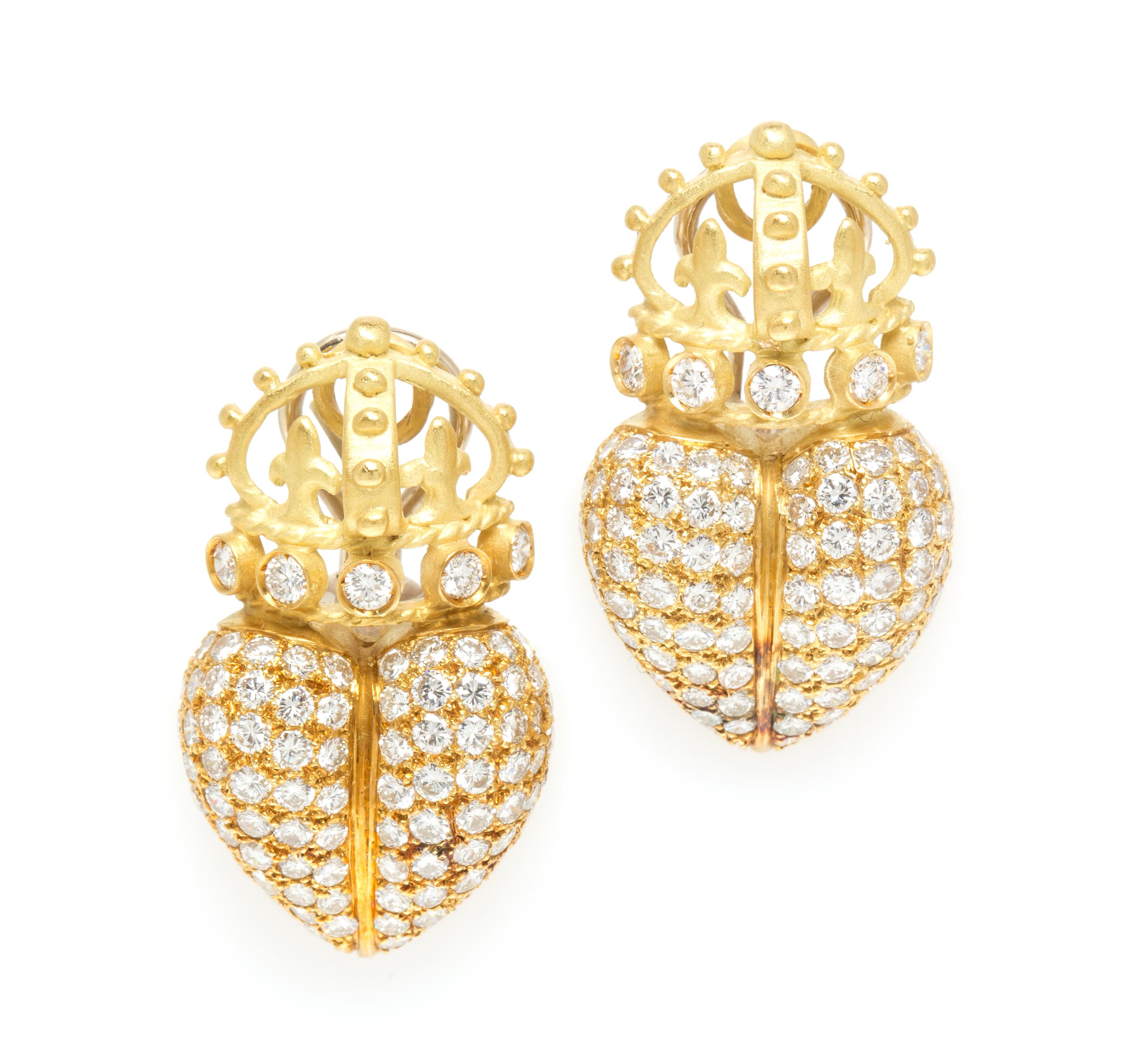 A Pair of 18 Karat Yellow Gold and Diamond Heart Earclips, 10.30 dwts.