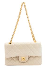 A Chanel Beige Quilted Leather Handbag, 9.25" x 5.5" x 2.5"; Strap drop: 9.75".