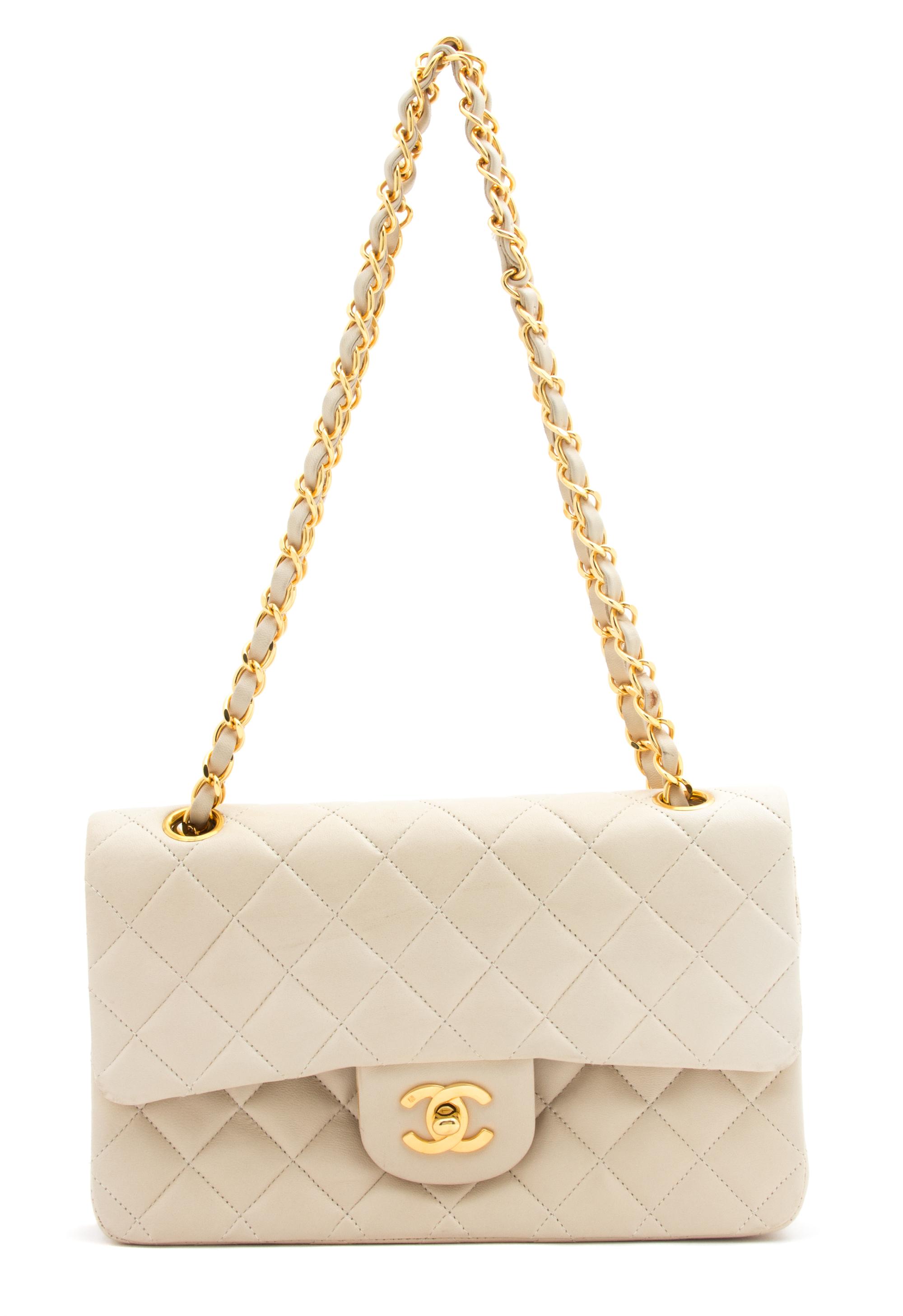 A Chanel Beige Quilted Leather Handbag, 9.25" x 5.5" x 2.5"; Strap drop: 9.75".