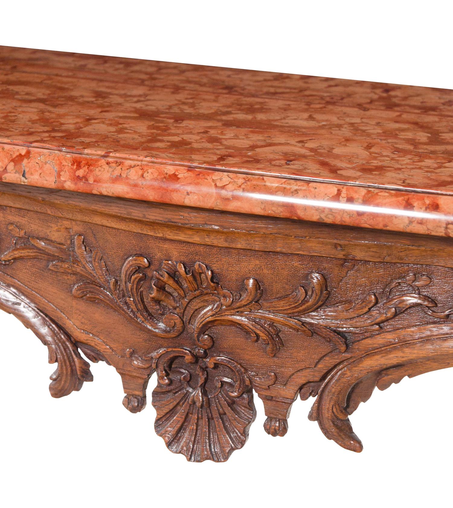 A Régence Carved Walnut Marble-Top Center Table