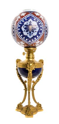 A French Gilt Bronze and Porcelain Oil Lamp, Height 29 3/4 inches.