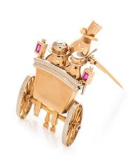 A Retro Bicolor 18 Karat Gold and Ruby Carriage Motif Brooch, Andre Col,