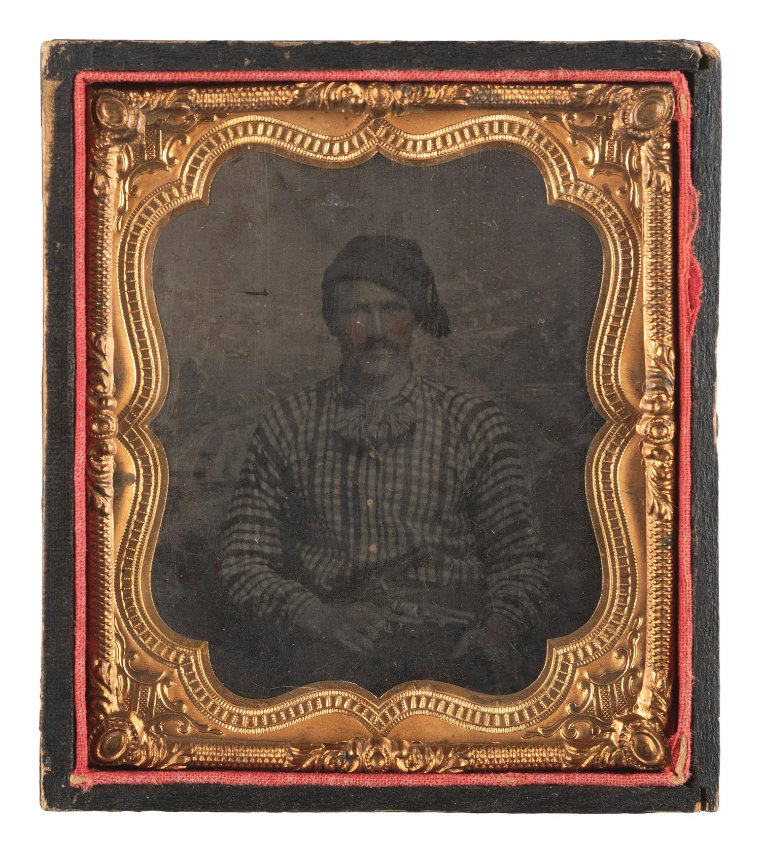 [CIVIL WAR]. Sixth plate tintype of a hearty fellow displaying a Model 1849 Colt pocket revolver and a sheathed Bowie knife.