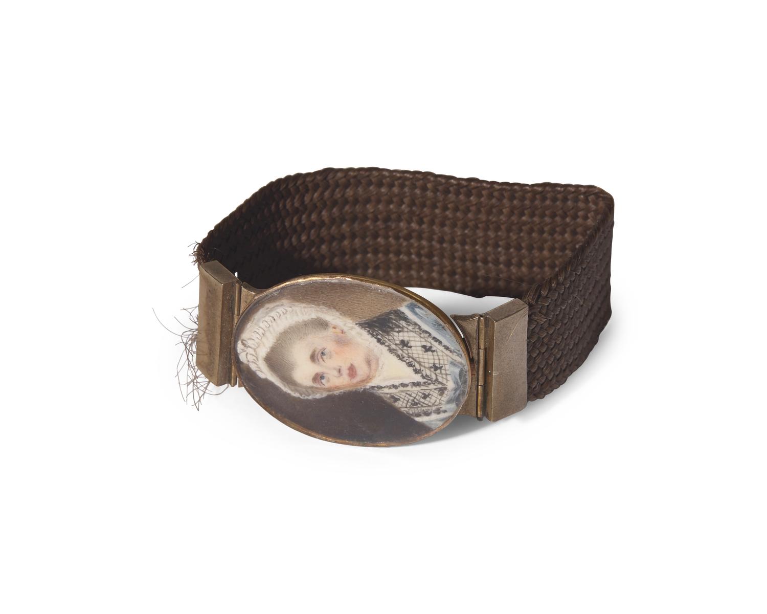English School 18th Century, A Hairwork Bracelet With Portrait Miniature Clasp Of A Lady In Blue Dress And Black Lace