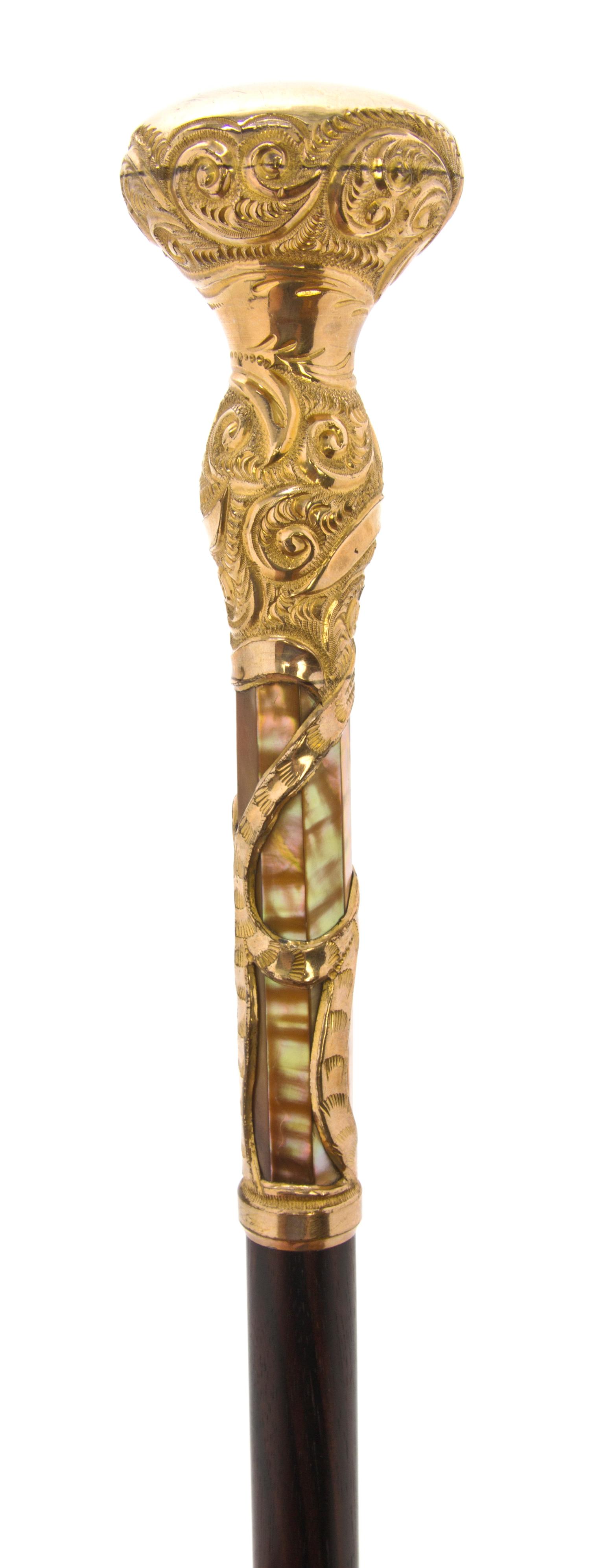 An American Chase and Embossed Gold-Filled Handled Walking Stick, Length of handle 6 7/8 x length overall 35 1/2 inches.