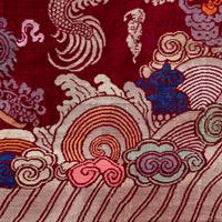 A Chinese Maroon Ground Silk Brocade 'Dragon' Robe, Jifu, Late Qing Dynasty 清晚期 絳紅地織錦龍紋吉服