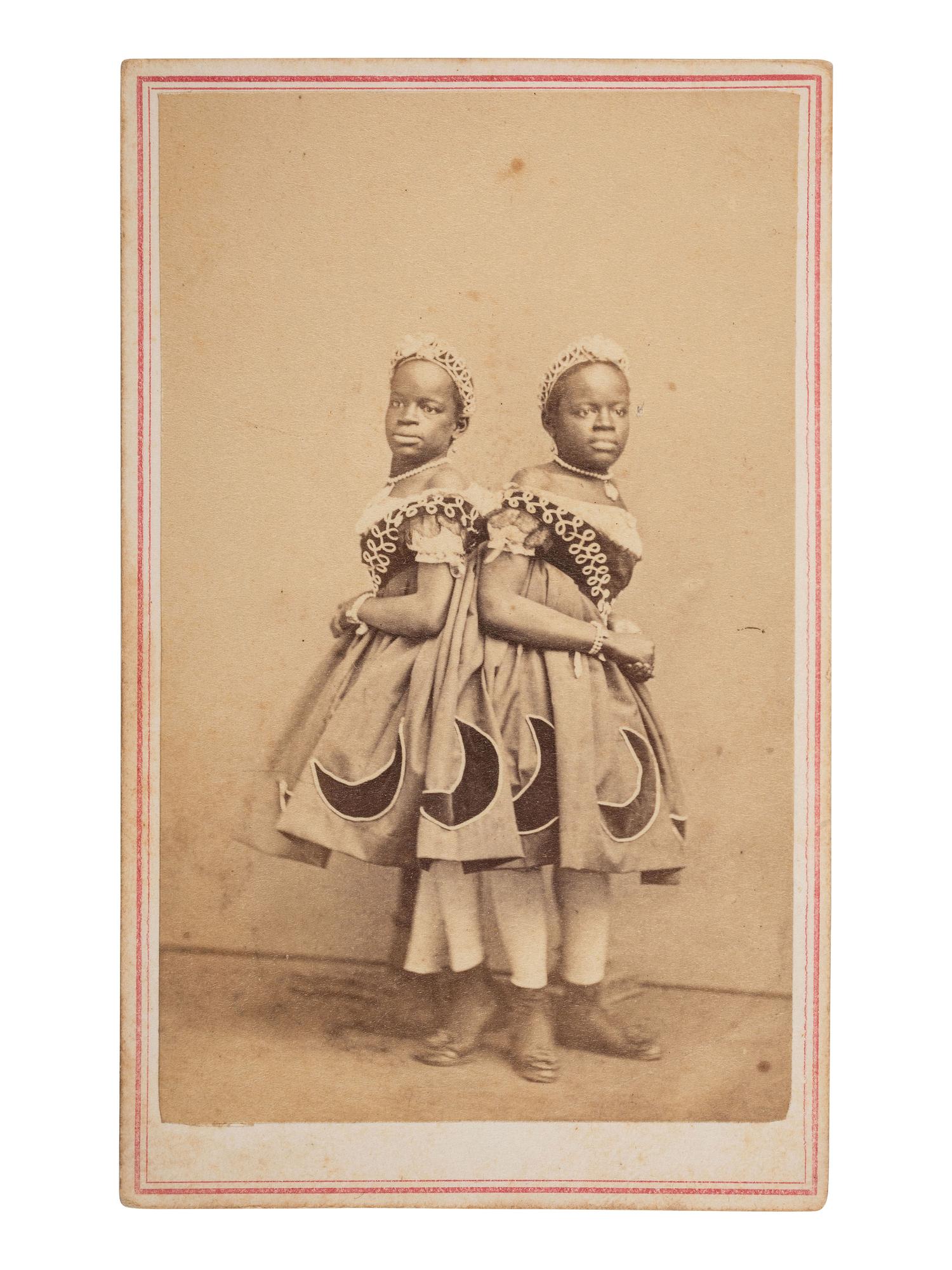 [MUSIC] -- [McKOY, Millie and Christine (1851-1912)]. HUGHES & Co., photographers. CDV of the famous conjoined twins from North Carolina. St. Louis, ca 1860s.