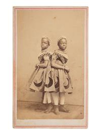 [MUSIC] -- [McKOY, Millie and Christine (1851-1912)]. HUGHES & Co., photographers. CDV of the famous conjoined twins from North Carolina. St. Louis, ca 1860s.