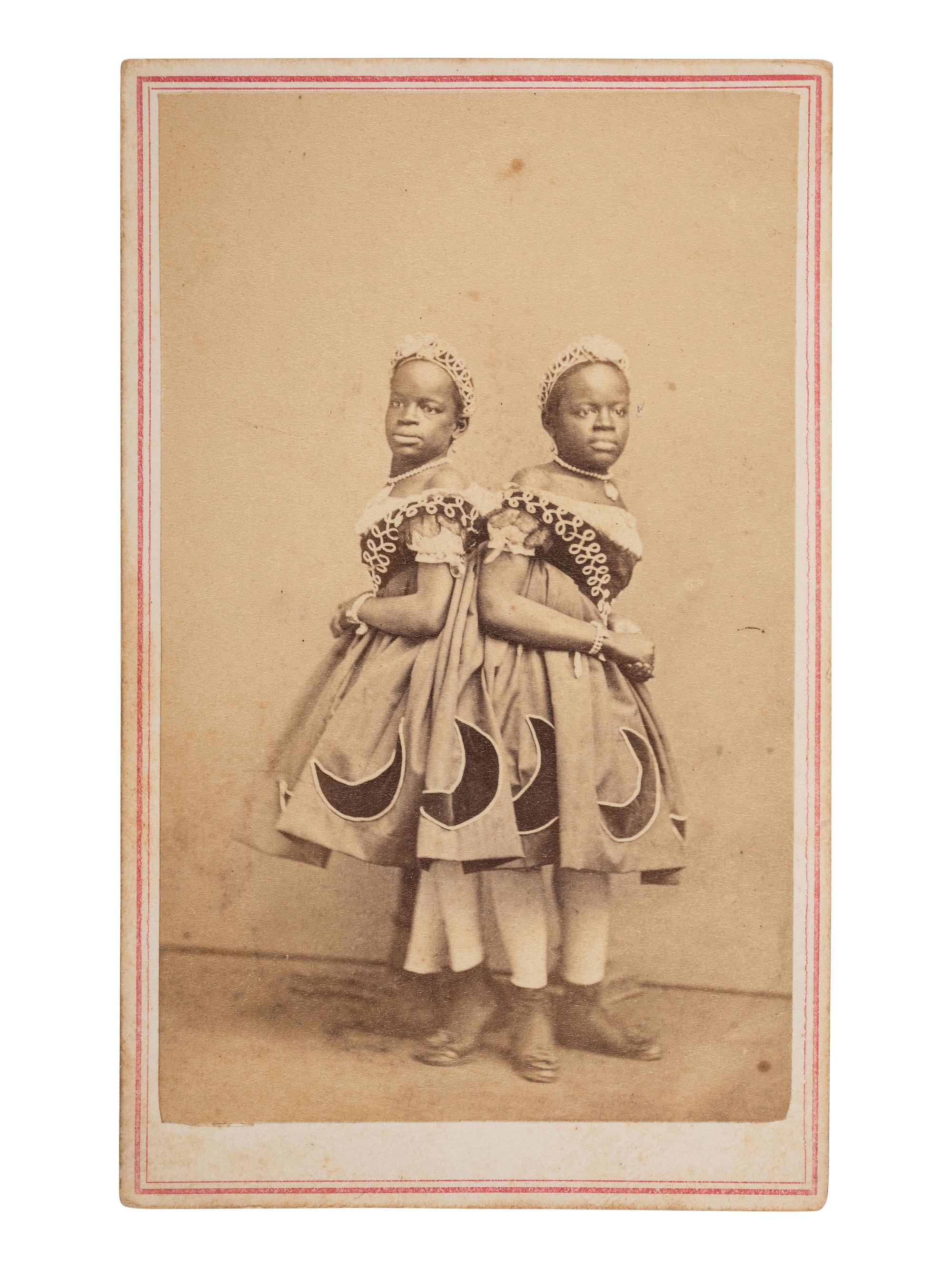 [MUSIC] -- [McKOY, Millie and Christine (1851-1912)]. HUGHES & Co., photographers. CDV of the famous conjoined twins from North Carolina. St. Louis, ca 1860s.