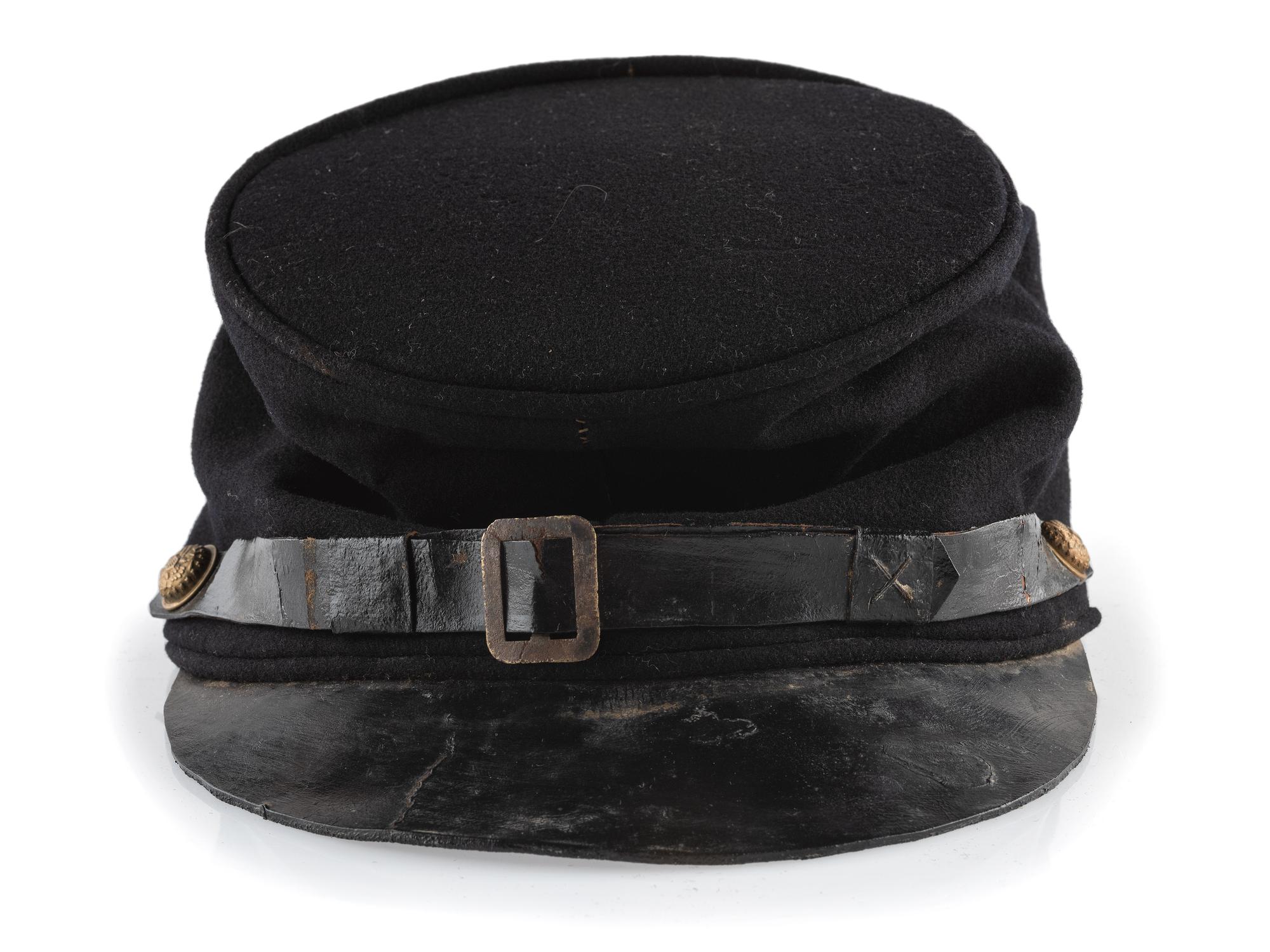 [CIVIL WAR]. A collection of items attributed to Thomas W. Johnson, Co. K, 4th Delaware Infantry, incl. frock coat, cap, belt rig, and cartridge box.