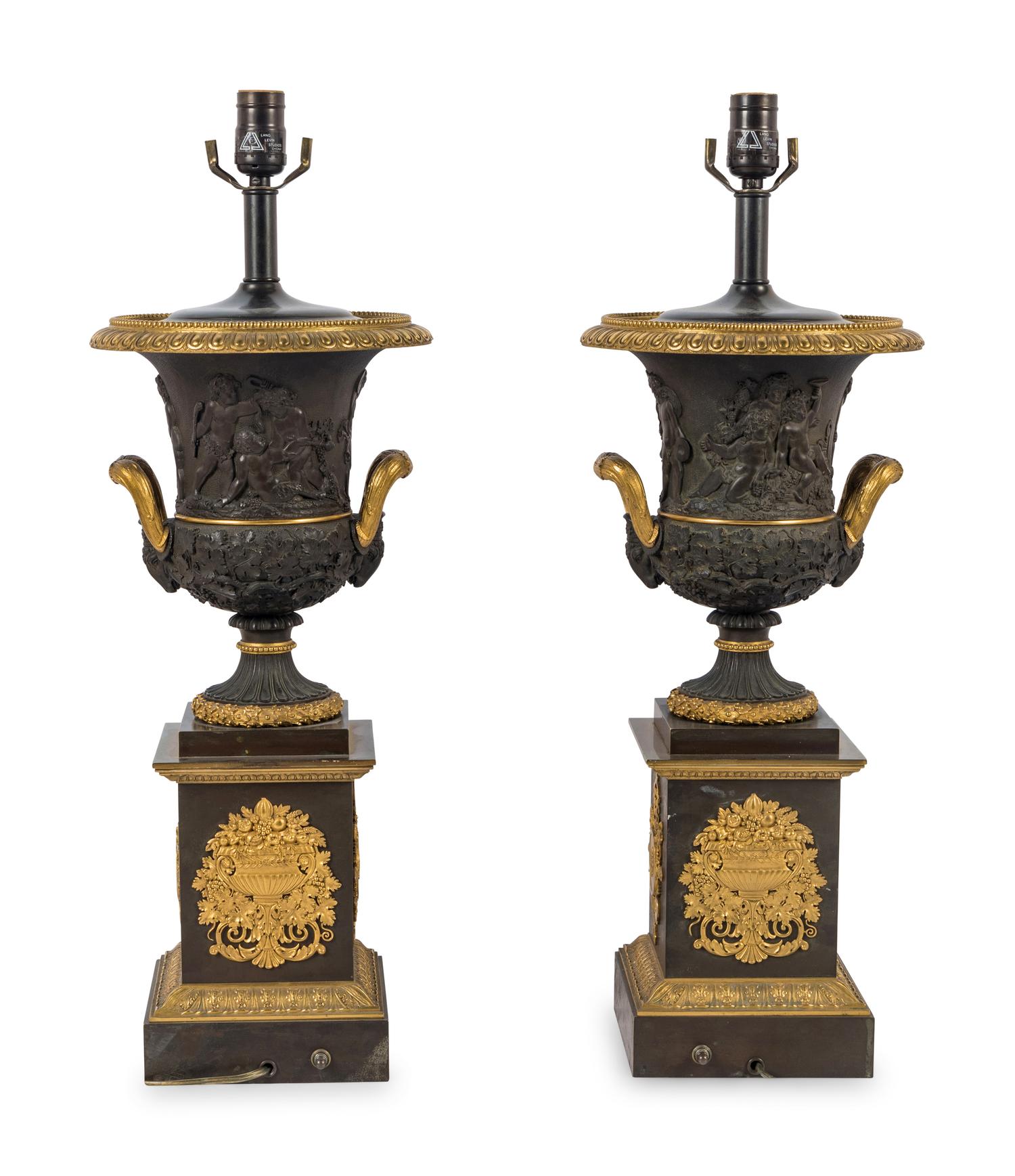 A Pair of Louis Phillippe Parcel-Gilt and Patinated Bronze Urns Mounted as Lamps