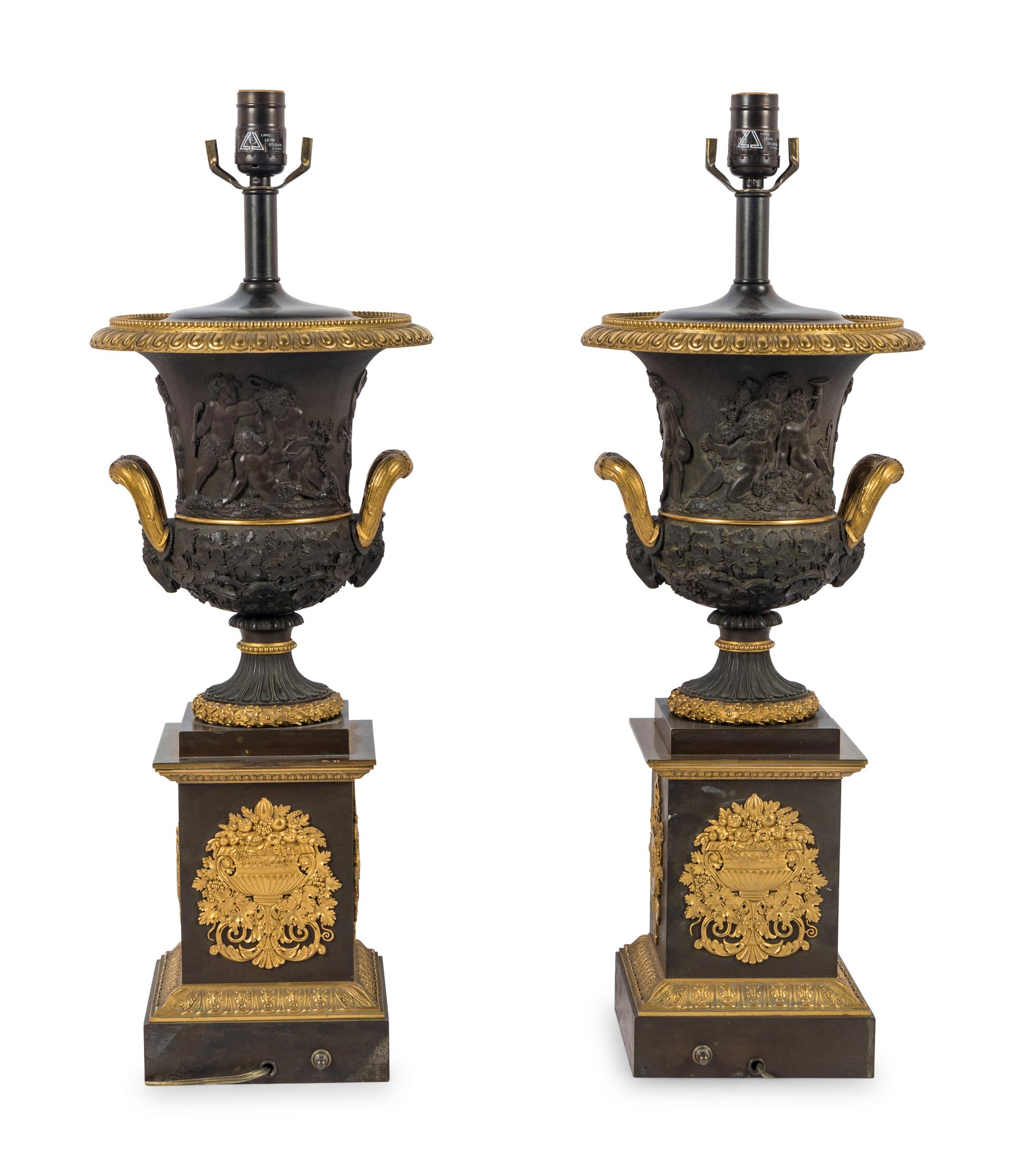 A Pair of Louis Phillippe Parcel-Gilt and Patinated Bronze Urns Mounted as Lamps
