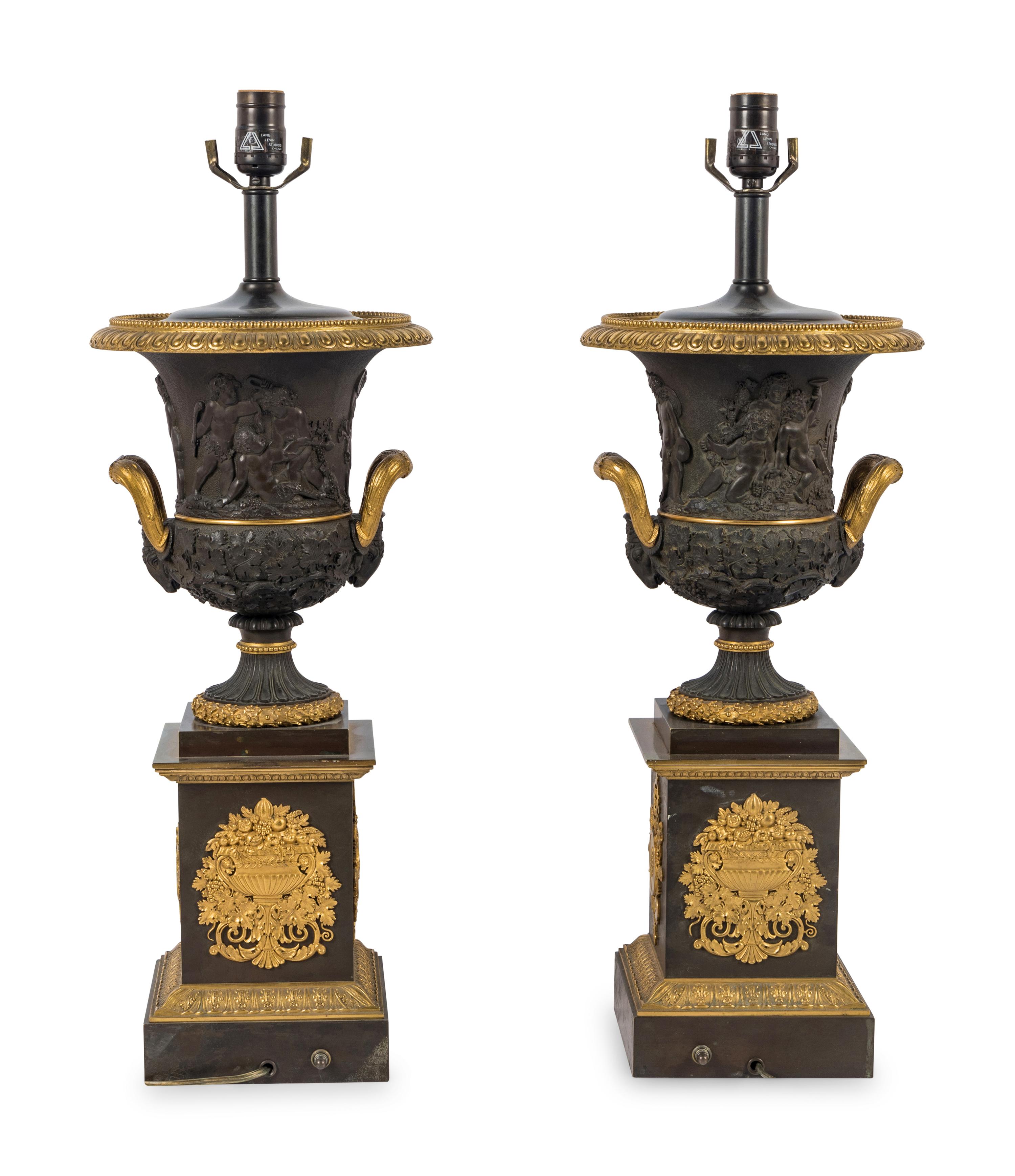A Pair of Louis Phillippe Parcel-Gilt and Patinated Bronze Urns Mounted as Lamps