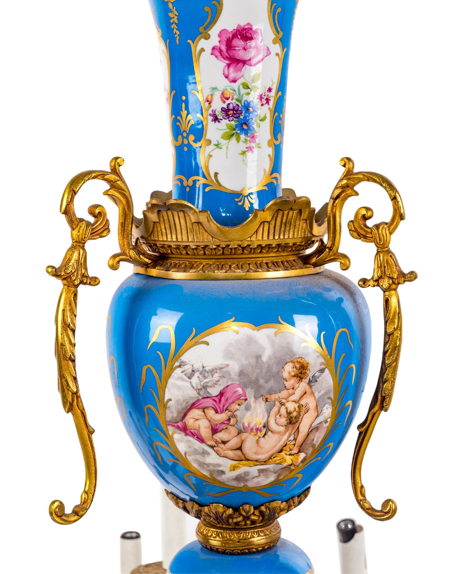 A Sèvres Style Gilt Metal and Painted Glass Eighteen-Light Chandelier