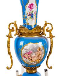 A Sèvres Style Gilt Metal and Painted Glass Eighteen-Light Chandelier