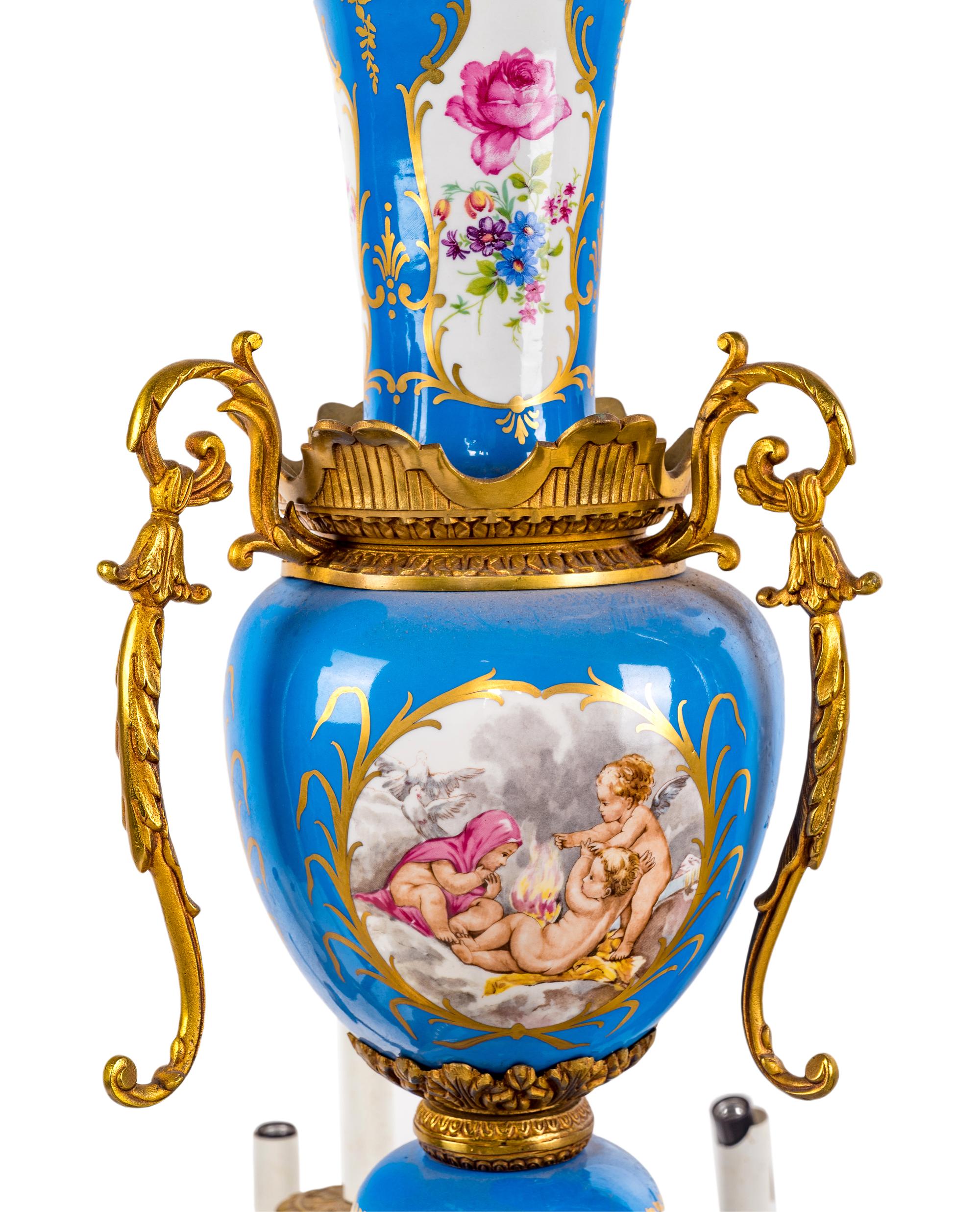 A Sèvres Style Gilt Metal and Painted Glass Eighteen-Light Chandelier