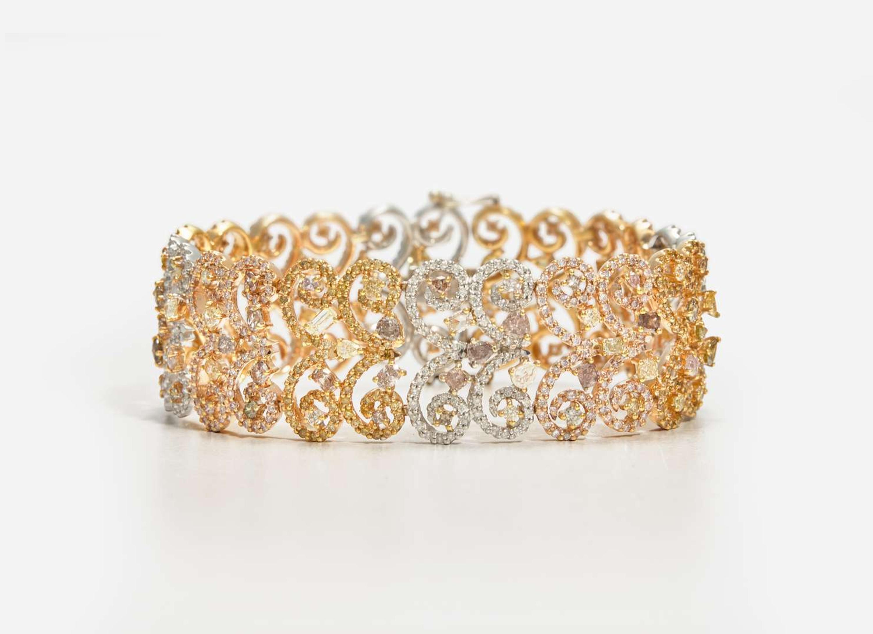 A Three-Tone Rose, White, and Yellow Gold and Multicolor Diamond Bracelet