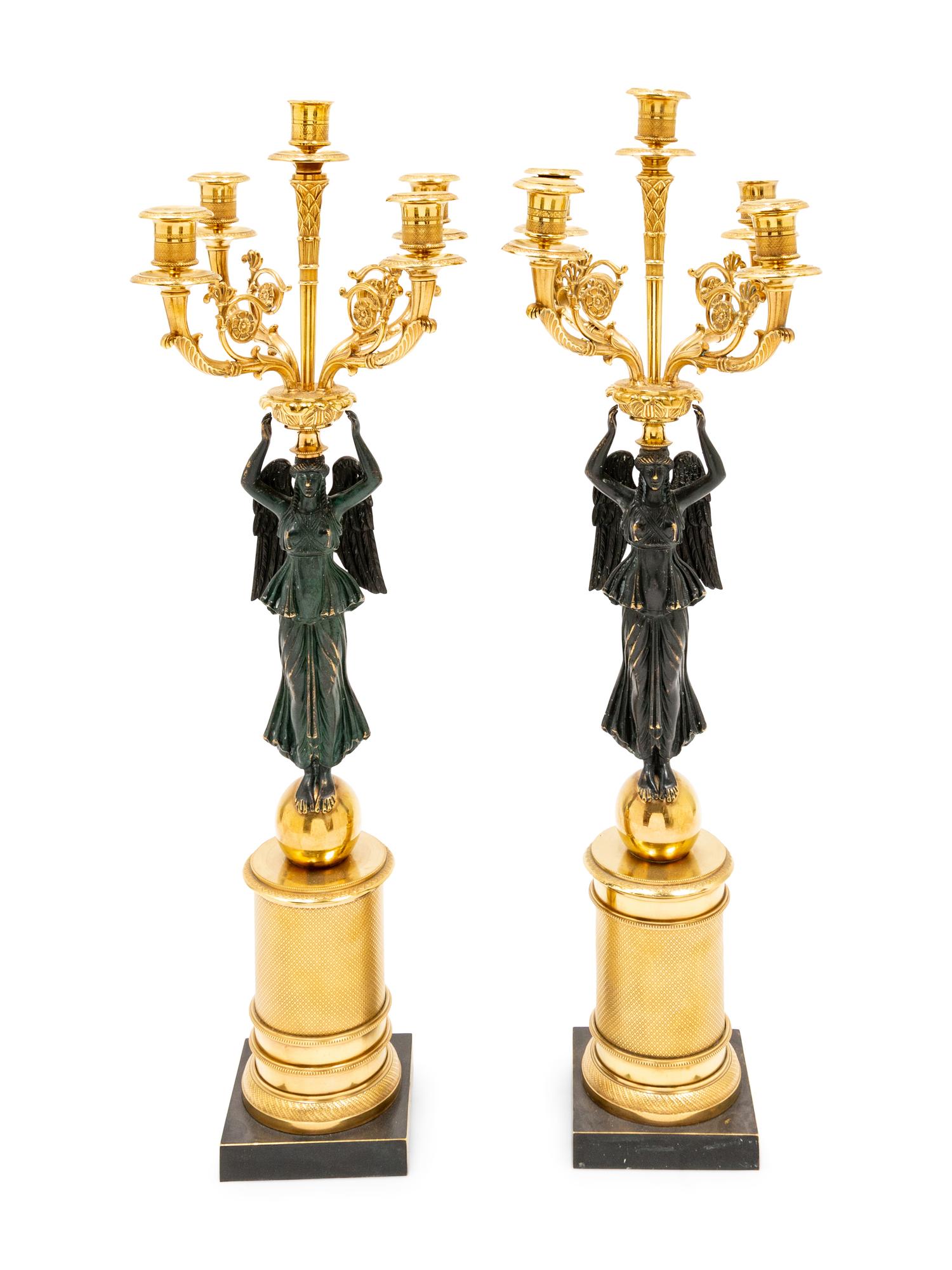 A Pair of Empire Style Gilt and Patinated Bronze Figural Candelabra