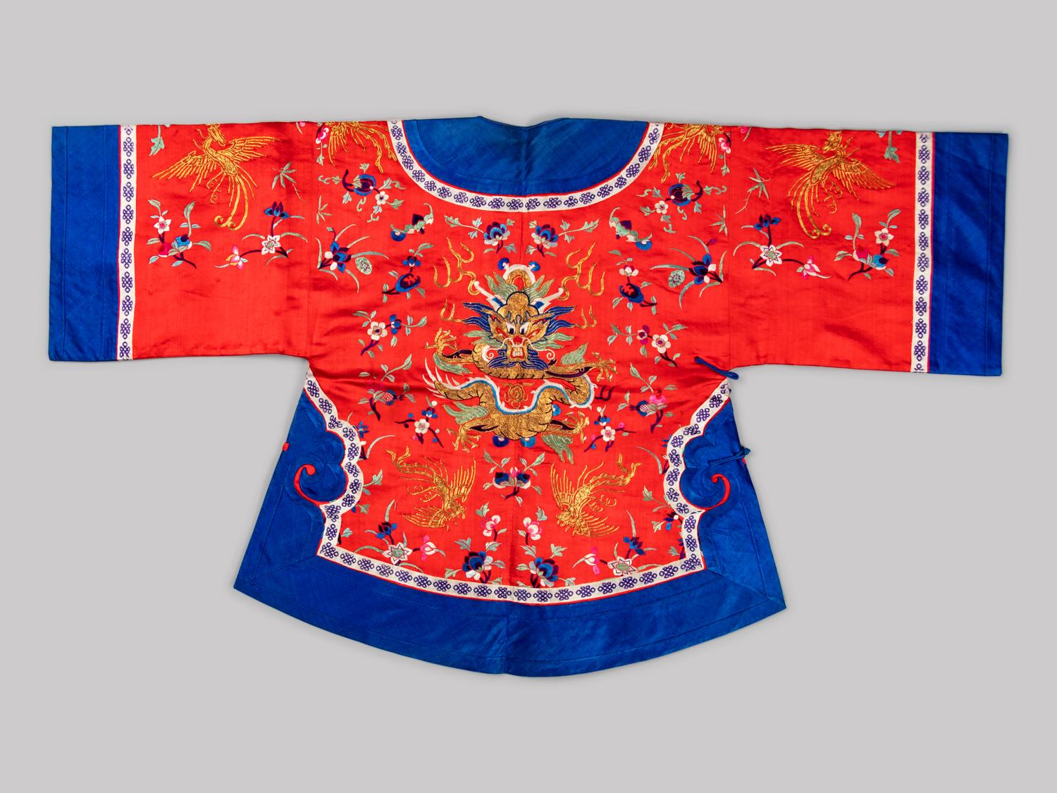 A Chinese Red Ground Embroidered Silk Ladies' Jacket