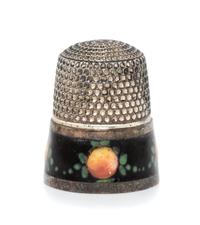 An American Silver and Enamel Thimble, , having a knurled top and body above a black enamel band decorated to show fruit and foliate de