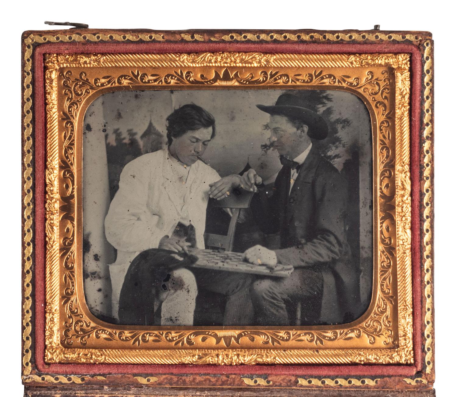 [EARLY PHOTOGRAPHY]. Sixth plate ruby ambrotype showing an intense game of checkers.